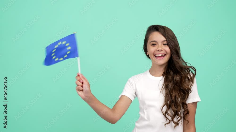 happy child waving european union flag on blue background showing thumb up, patriot happy child waving european union flag on blue background showing thumb up, patriot