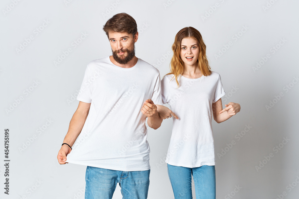 cheerful young couple in white t-shirts fashion advertising design cheerful young couple in white t-shirts fashion advertising design