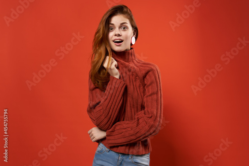 red-haired woman in red sweater jewelry earrings fashion
