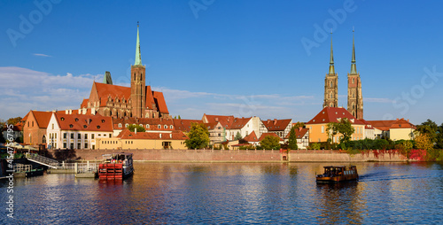 Sightseeing of Poland. Cityscape of Wroclaw. The view at Tumski island and Cathedral of St John the Baptist, Church of Our lady on the Sand, Odra river. 