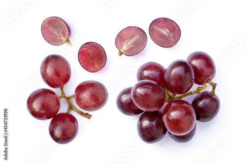 Red grapes fruit with half slice isolated on white background. 