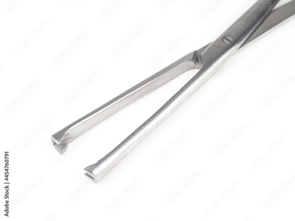 steel surgical clamp on white background