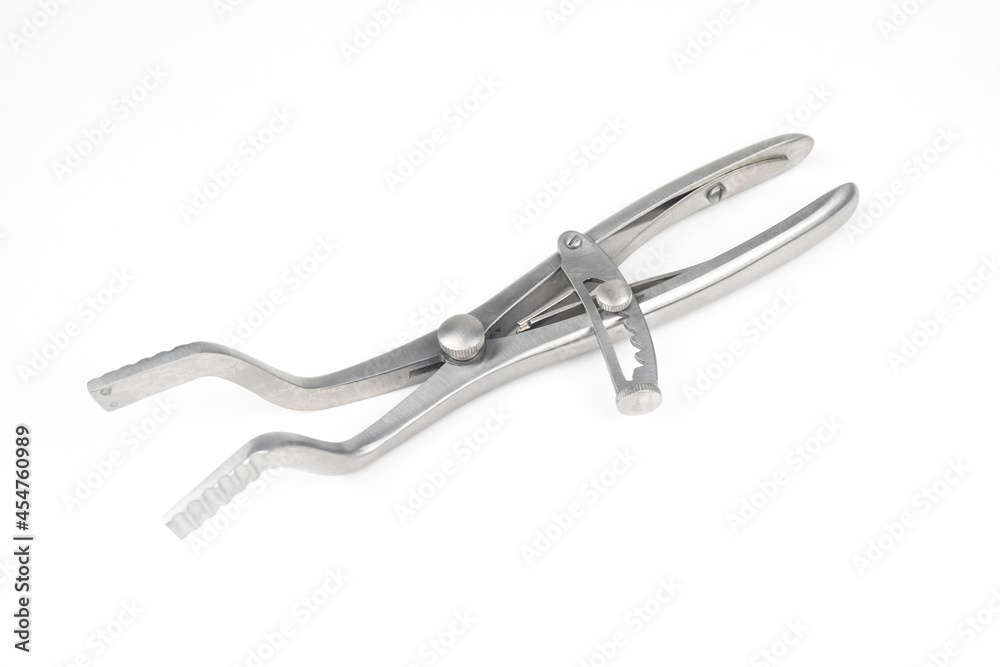 steel surgical clamp with retainer on a white background steel surgical clamp with retainer on a white background