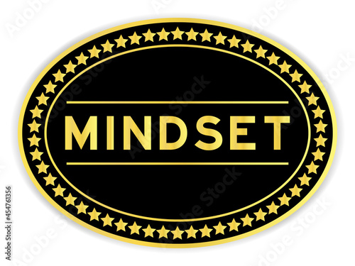 Gold and black color oval label sticker with word mindset on white background