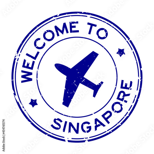 Grunge blue welcome to Singapore word with airplane icon round rubber seal stamp on white background