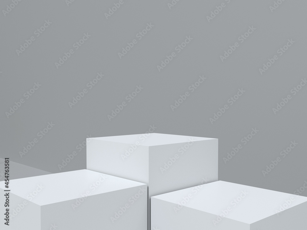 Three white podium and gray wall