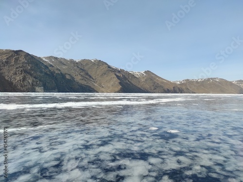 transparent lake covered with ice in winter