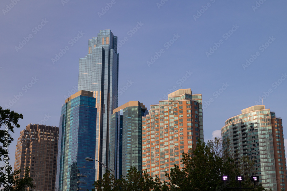 Modern Skyscrapers in Downtown Jersey City New Jersey and a Blue Sky Modern Skyscrapers in Downtown Jersey City New Jersey and a Blue Sky