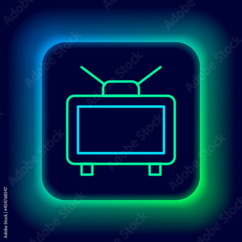 Glowing neon line Football soccer match on TV icon isolated on black background. Football online concept. Colorful outline concept. Vector