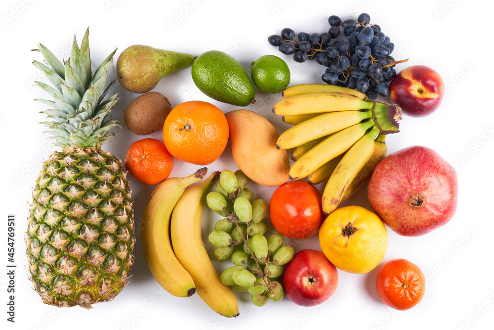 Mix of fresh juicy colorful exotic tropical fruits on white background top view Mix of fresh juicy colorful exotic tropical fruits on white background top view