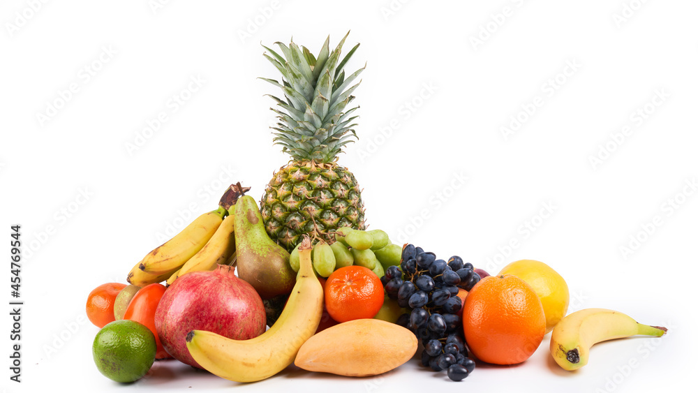 Mix of fresh juicy colorful exotic tropical fruits on white background