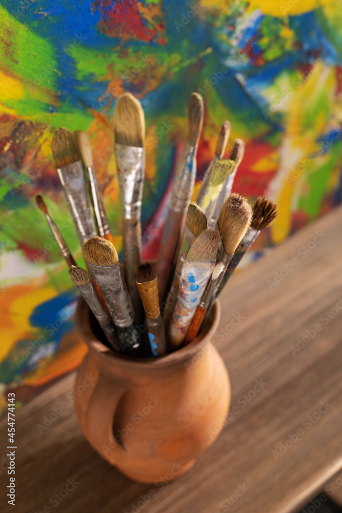 Fototapeta premium Paint brush and art painting canvas as abstract background texture. Paintbrush painting