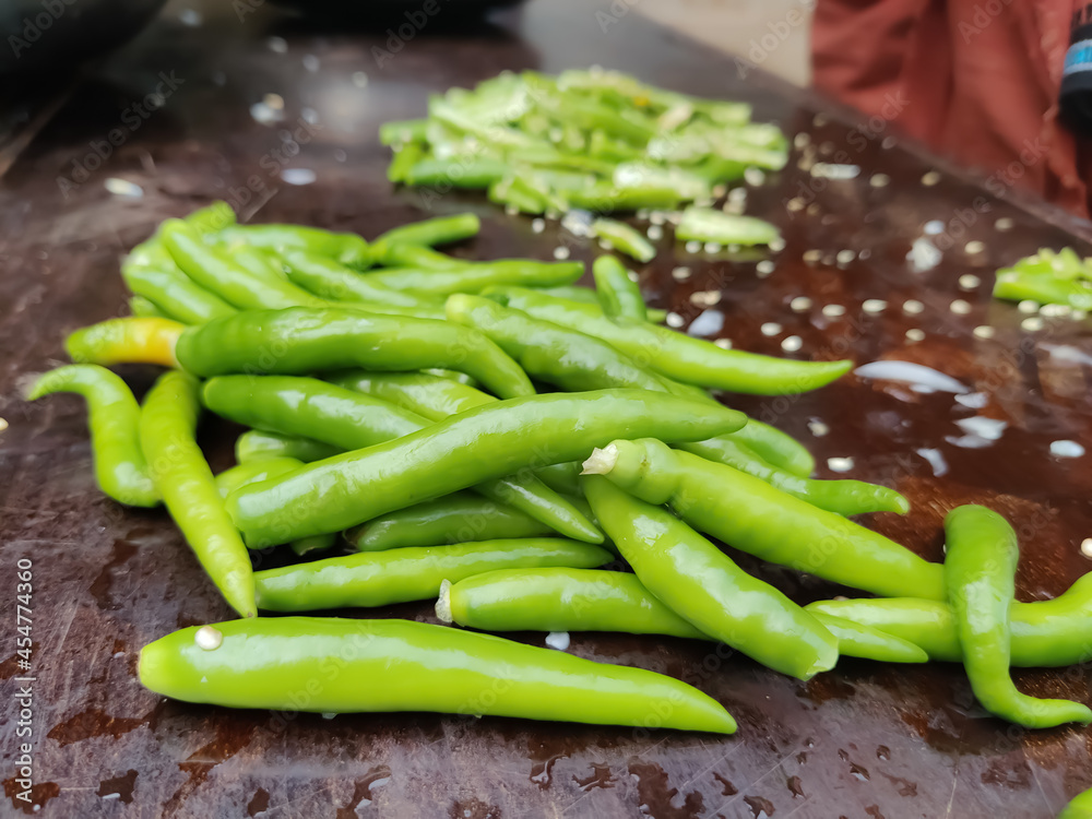 Green chili peppers on the table closeup shot Green chili peppers on the table closeup shot