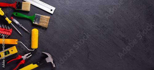 Construction tools at black background. Tool for renovation