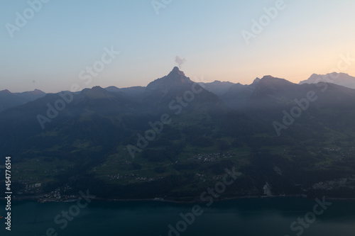 Amazing view over Lake Walen in the Canton Glarus, Switzerland. Wonderful sunset and sunrise in the swiss alps. This is a great place to hike and enjoy the beautiful nature in Switzerland.