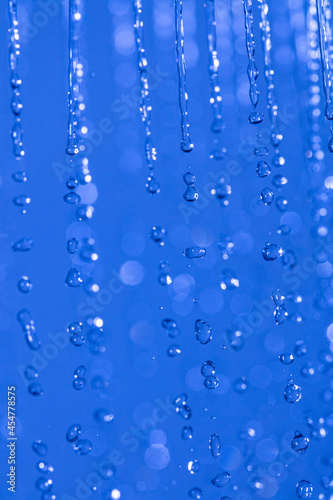 water drops in the air on blue background