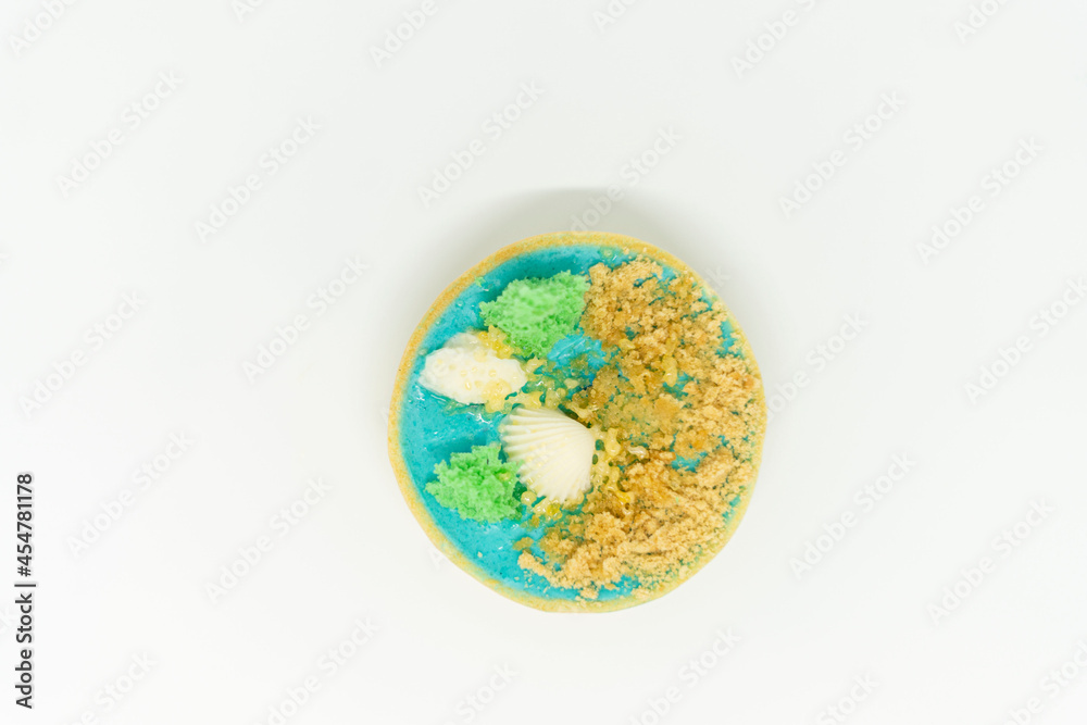 Top view. One round delicious tartlet on a white background