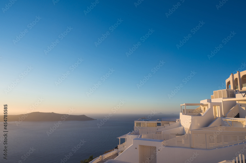 White architecture of Imerovigli on Santorini island, Greece. Luxury resort. View of Aegean sea and caldera.