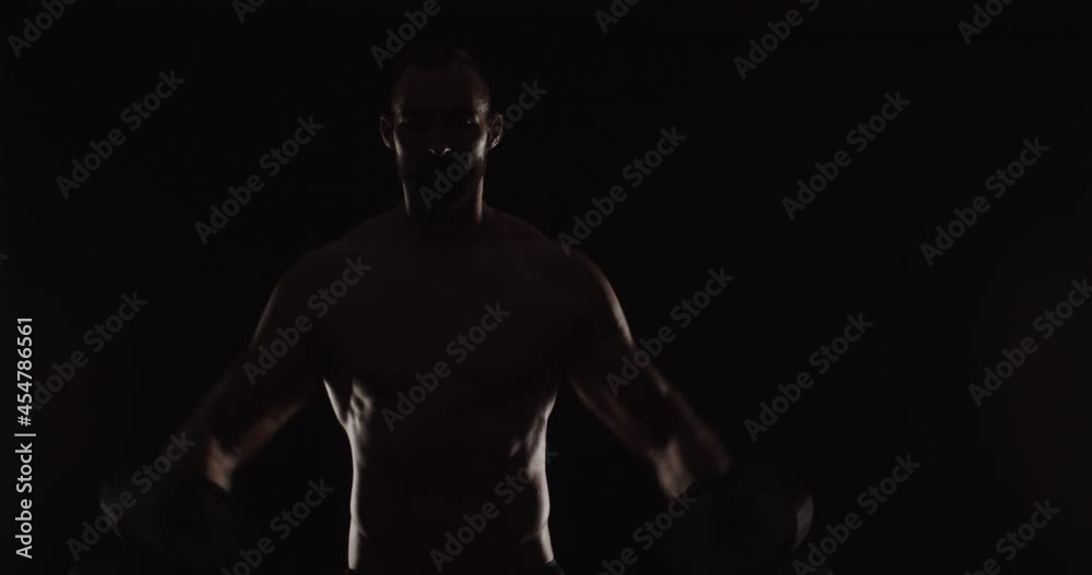 Silhouette of topless guy exercising Silhouette of topless guy exercising