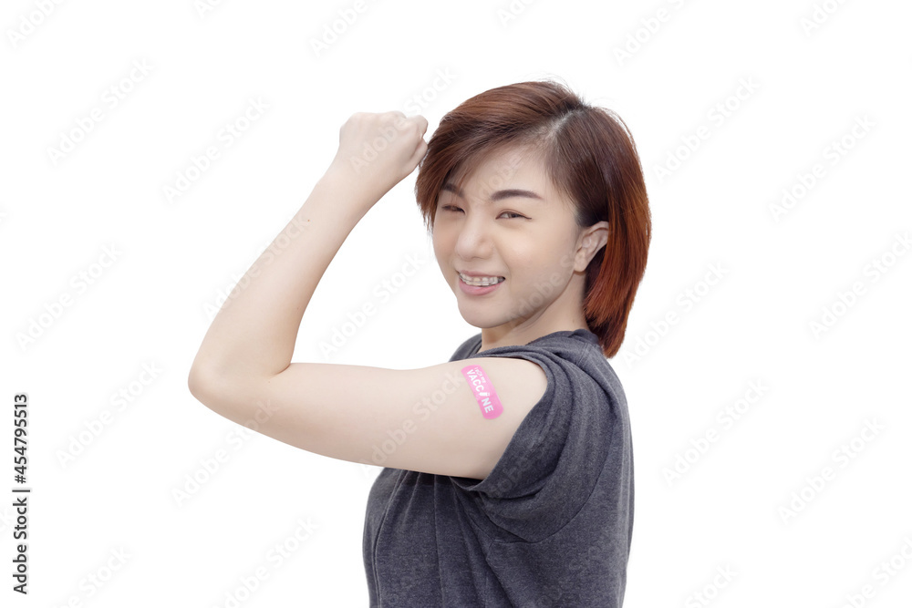 Woman with Bandage Plaster Showing Her Fist Up after Getting Covid-19 Vaccination Woman with Bandage Plaster Showing Her Fist Up after Getting Covid-19 Vaccination