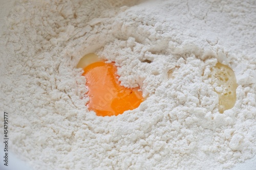 Eggs in the bowl of flour