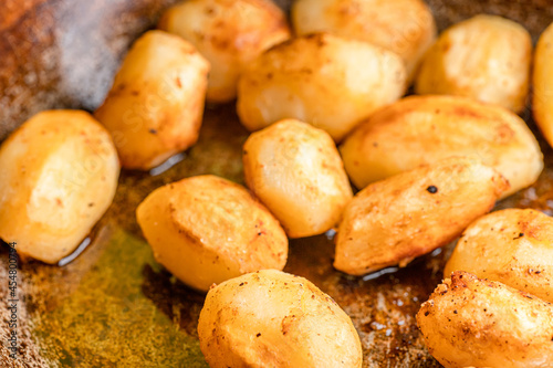 Whole fried potatoes in oil