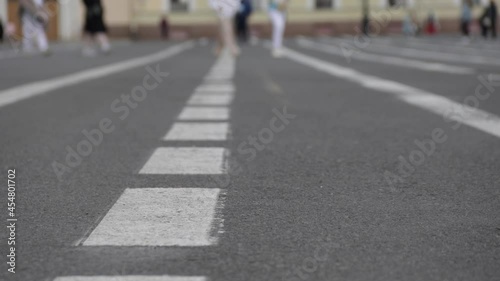 Wallpaper Mural People walking on the street, white lines on the asphalt Torontodigital.ca