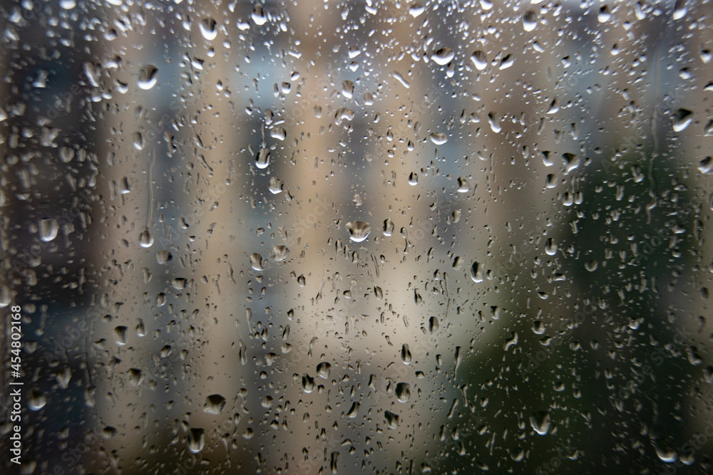 Wet window glass with raindrops cold weather