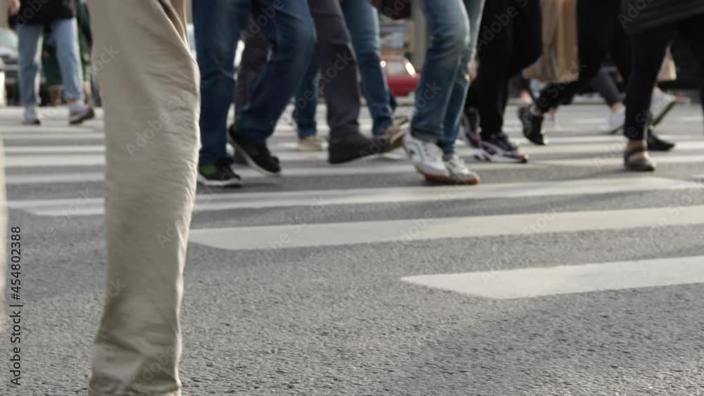 Busy people crowd are crossing the street Busy people crowd are crossing the street