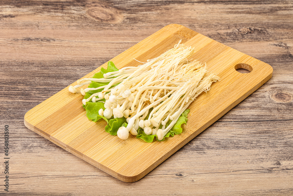 Raw Enoki mushrooms for cooking Raw Enoki mushrooms for cooking