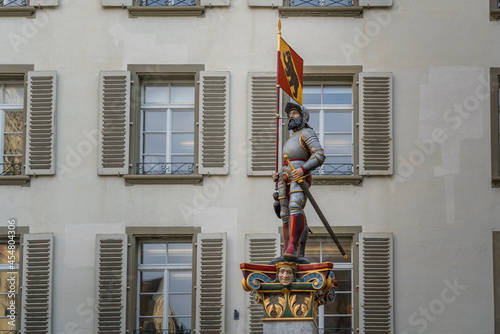 Banneret Fountain (Vennerbrunnen) - one of the medieval fountains of Bern Old Town with a Swiss Knight Carrying a Standard - Bern, Switzerland photo