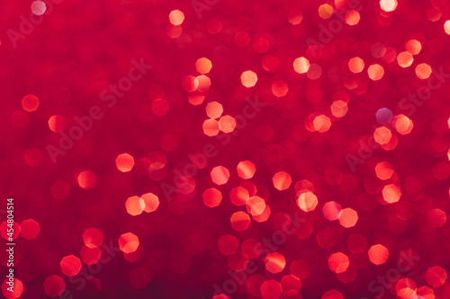 Red glowing sequins blurred background