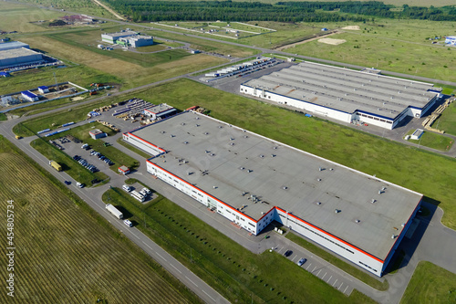 Large logistics park with warehouse, loading hub in industrial zone and technology park. Aerial view