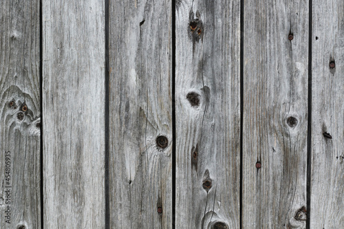 grey wooden plank wall with nails
