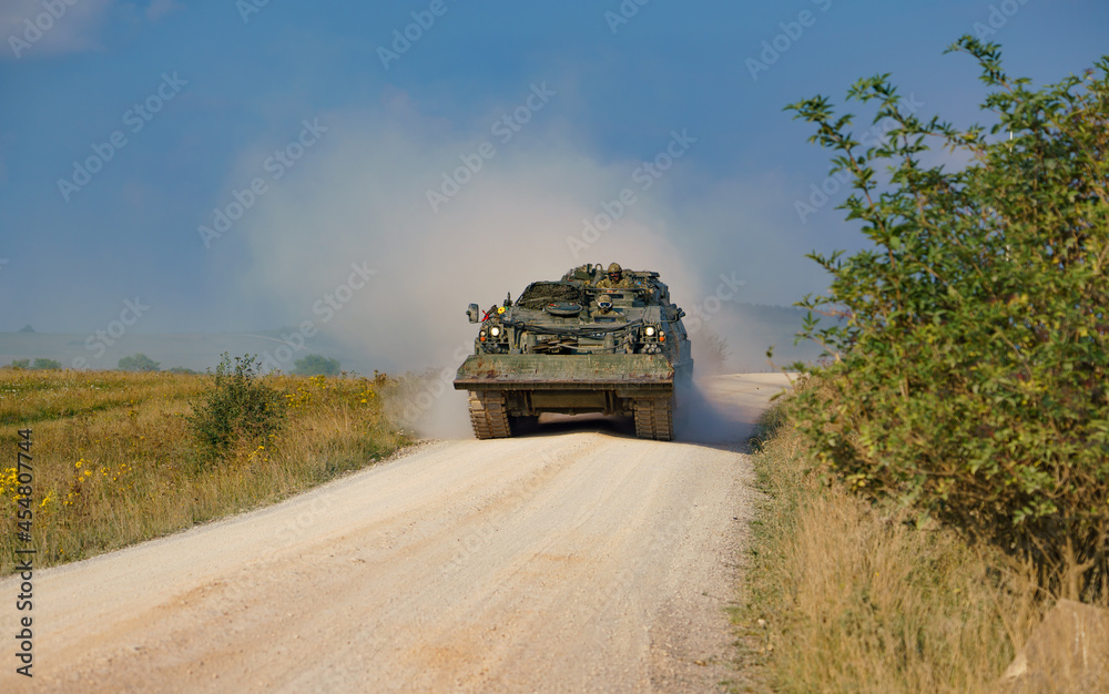 close up of a British Army Challenger Armored Repair and Recovery Vehicle (CRARRV) in action on a military training exercise, salisbury plain wiltshire UK