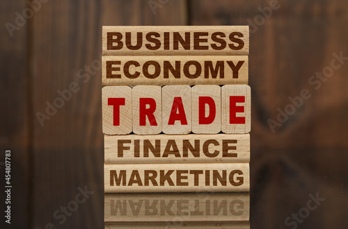 Wallpaper Mural Wooden blocks with the text - Business, Economy, Finance, Marketing and TRADE Torontodigital.ca