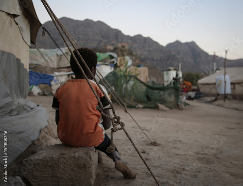 A child lives with his family in a camp for displaced people fleeing the hell of war in the city of Taiz, Yemen