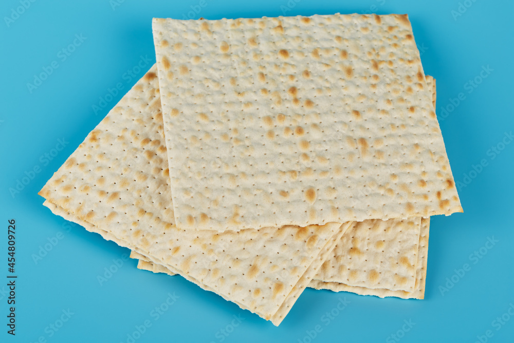 Matzah for the Jewish holiday of Passover on a blue background