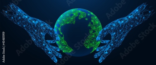 Two hands hold the planet Earth. The concept of protecting nature and the environment. Polygonal construction of lines and points.