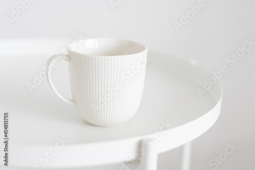 white mug on a white table  minimalism