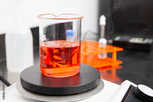 Magnetic stirrer mixing a liquid in a beaker at laboratory