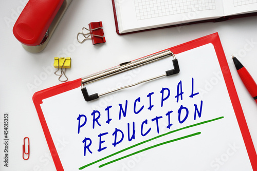 Business concept about PRINCIPAL REDUCTION with inscription on the piece of paper. photo