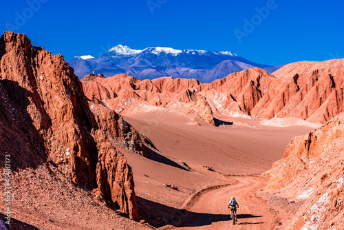 A cyclist in the Valle de La Muerte (Valley of Death) in Atacama Desert in Chile