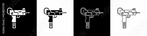 Set UZI submachine gun icon isolated on black and white background. Automatic weapon. Vector