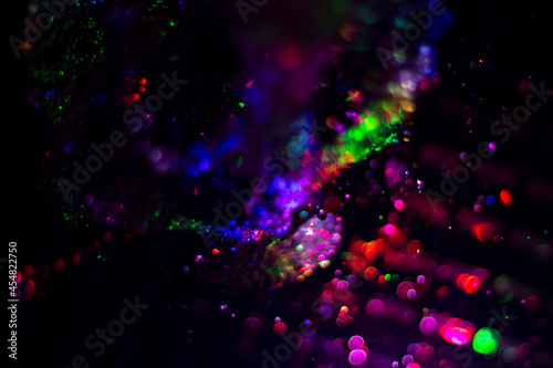 Colored water texture. Splashes of water lit in different colors. © Олег Копьёв