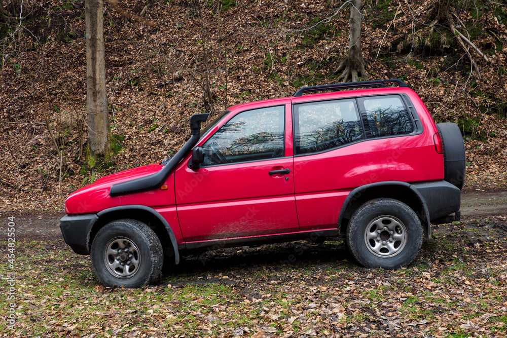 Three door red SUV with upper air intake. Three door red SUV with upper air intake.