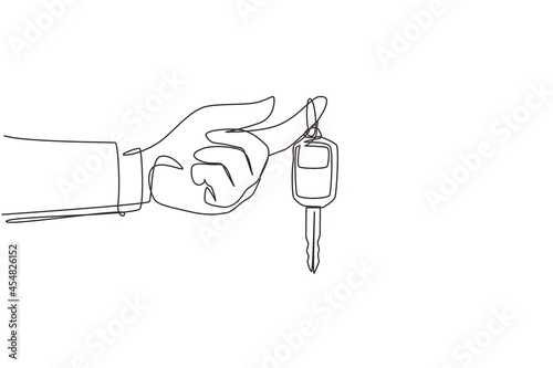 Single one line drawing hand holding hanging car key and alarm system. Hand holding car key with alarm keychain. Hand of car salesman manager holding key. Continuous line draw design graphic vector