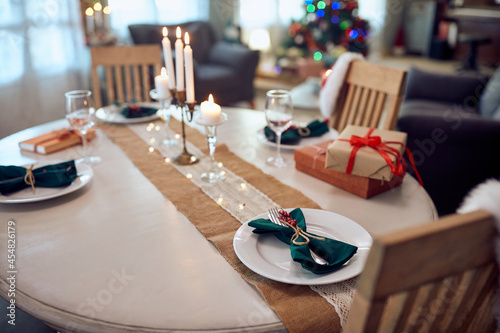 Christmas table setting in dining room at home.