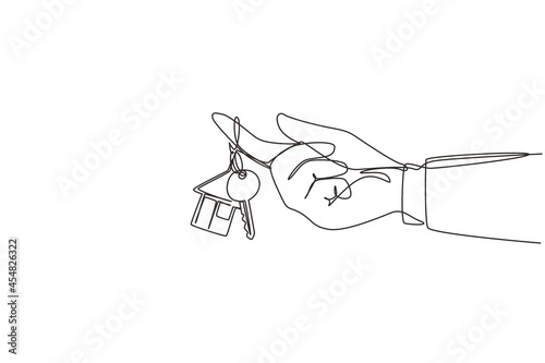 Single one line drawing hand hold a key of house or apartment. Real estate. Man hand holding key from house isolated on white. Buying the house. Continuous line draw design graphic vector illustration