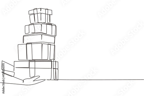 Single one line drawing woman hands gives gift in boxes. Girl holding huge stack New Year presents. Millennial female carrying pile of wrapped gifts box. Continuous line draw design graphic vector